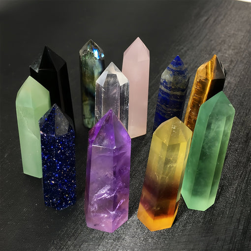 A collection of assorted colored crystal towers for energy work and healing