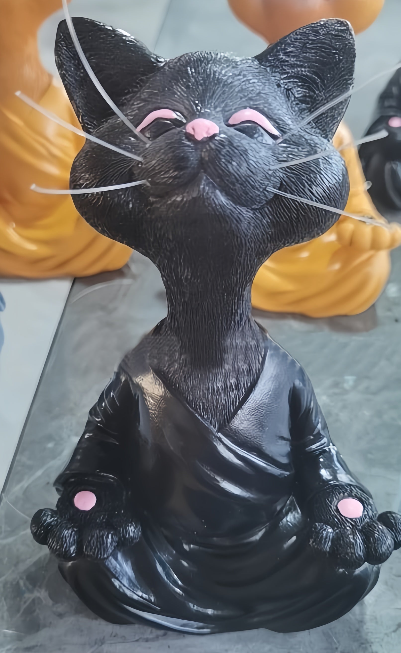 Close-up of meditation cat statue