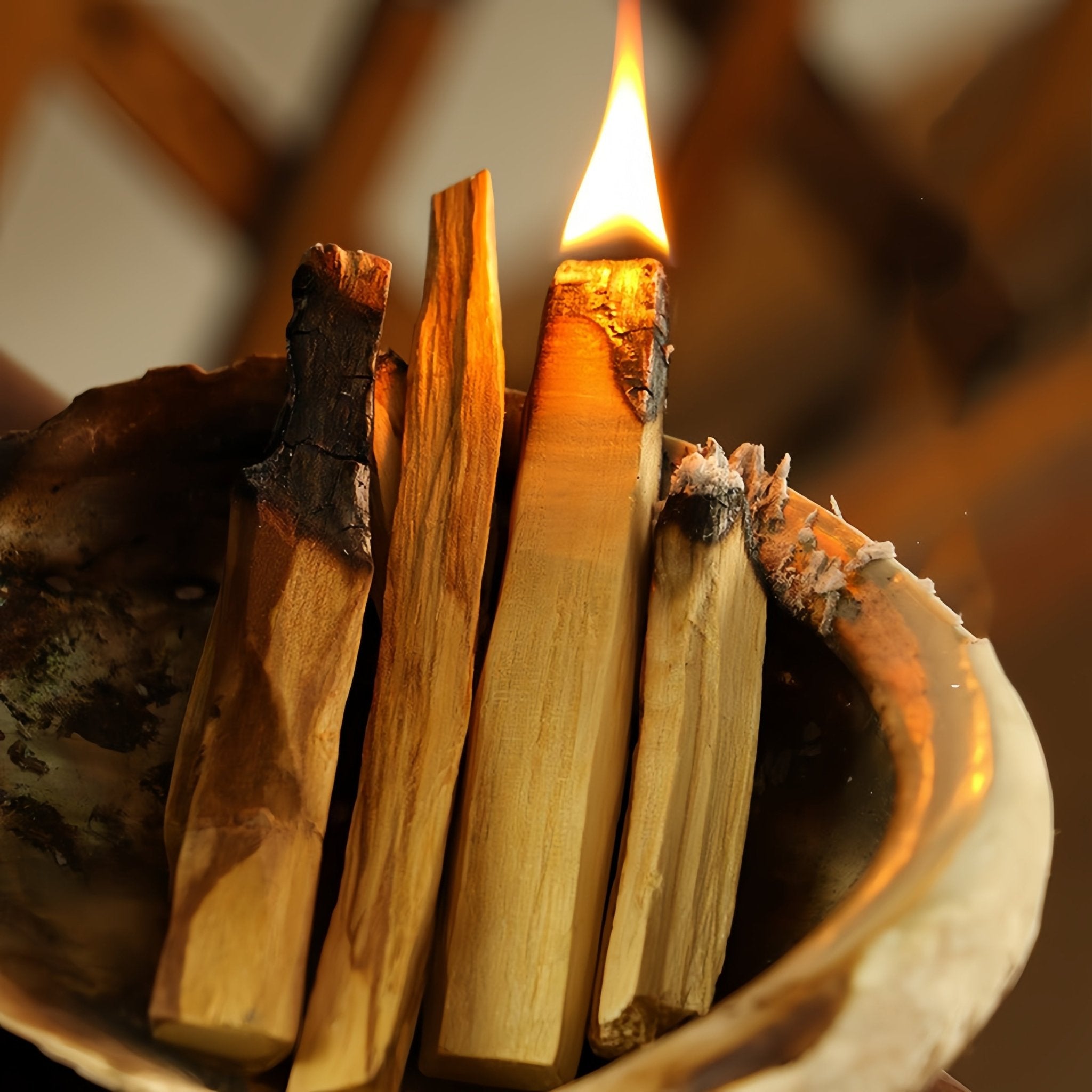 Image of Peruvian Palo Santo wood ignited, showcasing the aroma released during burning.