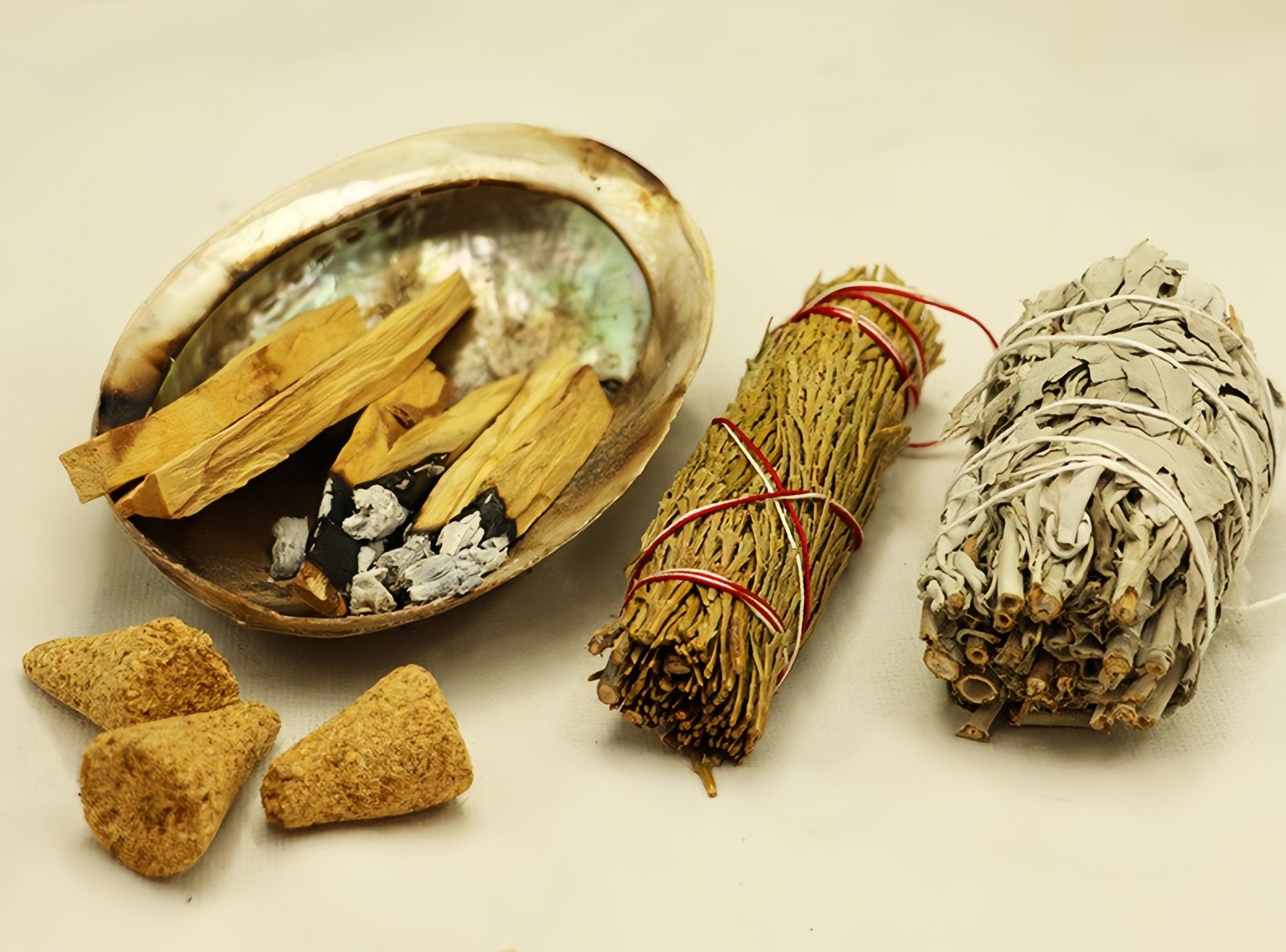 Overview of Palo Santo wood and other cleansing ritual accessories.