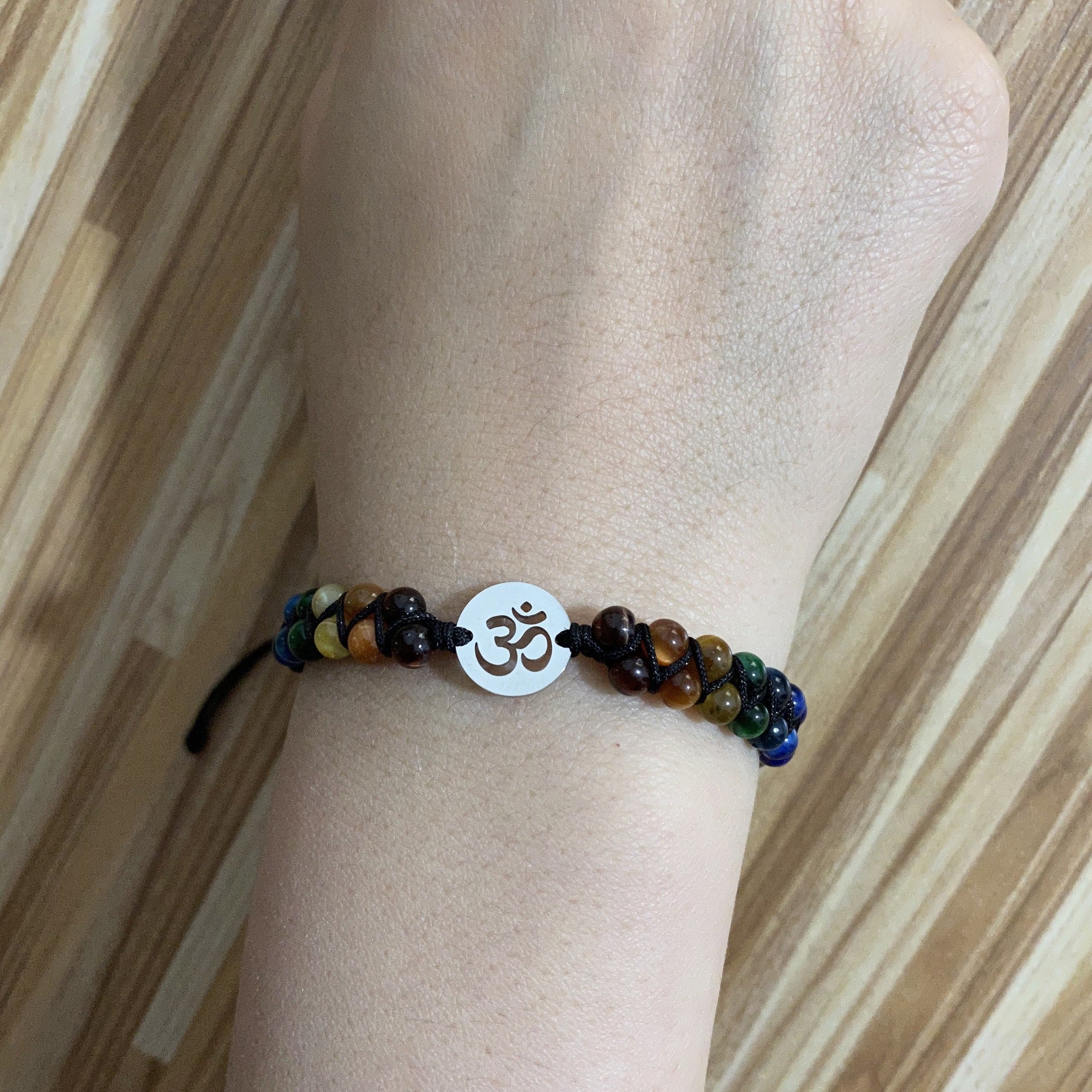 Seven chakra bracelet worn on the wrist